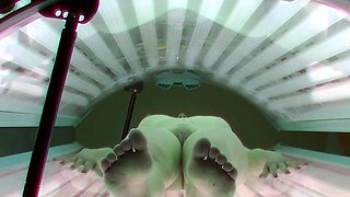 Young redhead in solarium