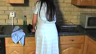 British wench Michelle plays with herself in the kitchen