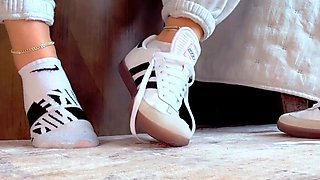 Brunette with foot fetish rubs big dick with her feet in POV