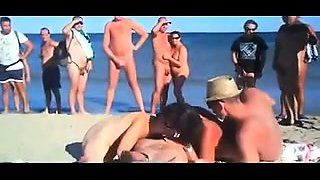 Lustful amateur swingers indulge in group sex on the beach