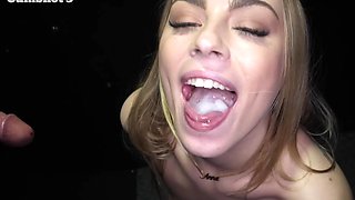 Girls share cock through a hole in the wall, swallowing loads.