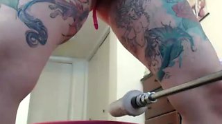 Tattooed girl fucked the machine good