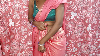 Desi hot bhabhiji wearing pink saree in the bedroom