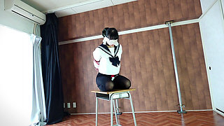 A Woman Is Being Punished While Wearing a Vibrator-equipped Chastity Belt.
