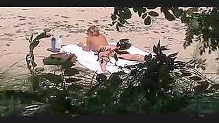 voyeur catches MILF on a beach