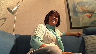 Sexy MILF moans as she fucks her shaved pussy with a dildo