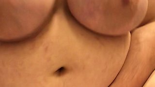 Busty curly brunette with big boobs fucks on couch