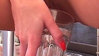 She Is Pissing in a Glass for Him