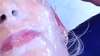 Blonde babe gets her face covered by cum