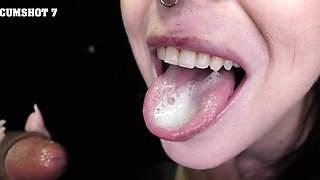 A woman sucks through a hole in the wall, gets cum in mouth.