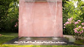 Busty Lucy Under Garden Water Wall