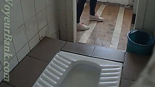 Sweet white blondie in tight blue jeans pissing in the toilet
