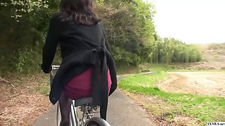 Mature Japanese girl bottomlessly rides a bike and has sex on the street