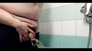 Eve Once Again Takes Adams Fat Uncut Dick and Pisses Adam in the Shower. Adam Is a Messy Boy When He Is Peeing with His Foreskin