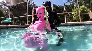 Amateur lesbian freaks in latex having fun in the pool