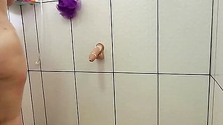 Very naughty stepmom takes a shower with the door open and rolls naked with her thick cock!