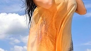 Busty babe playing with her big boobs