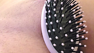 Ana Liz rubs her nipples with the brush...