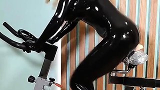 Freaky milf in latex rides a toy all the way to climax