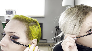 Man and Woman Putting on Mascara and Fake Lashes