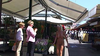 Blonde is flashing her big boobs in the outdoors