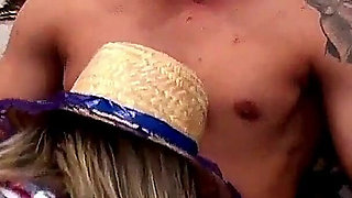 Hot Blonde in a June Festival Costume Sits Down Sexy