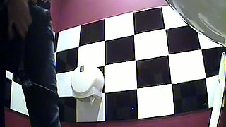 Slender and young blonde girl in the public toilet room pisses