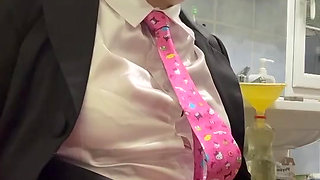 Dressed in a small pink skirt to pee in a bottle