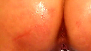 Cute Oiled Babe Masturbates with Cock