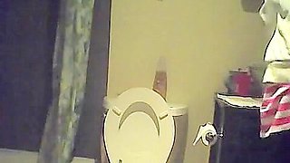 Hidden piss cam in the home toilet shows peeing sister