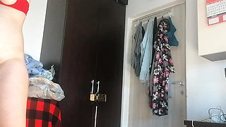 Amateur woman has fun trying on clothes and cutting them.