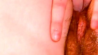 Hot Redhead with Big Boobs and Pierced Nipples Fingers Her Wet Hairy Pussy on Her Bed