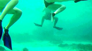 Beach voyeur films sexy babes in short bikinis under water