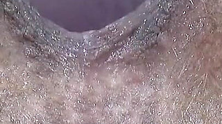 Extreme Close-up of Wet Hairy Vagina with Dildo
