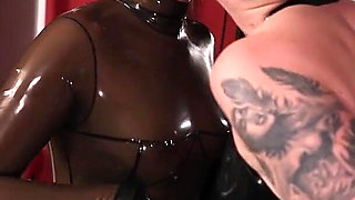 Rubber Queens Ignore Gimp as They Make Out