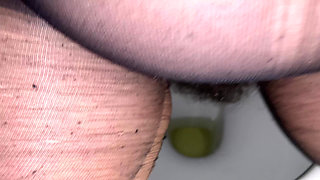 On the Toilet in Pantyhose the MILF Pisses and Then Gives Blowjob