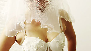 Hotwife Poses in a Bride Costume