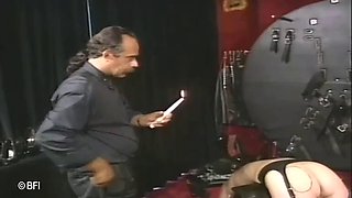 Submissive female gets tied up to a wheel
