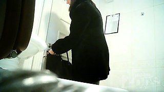 Amateur brunette with a marvelous ass pisses on hidden cam