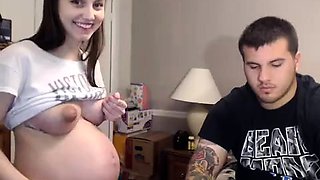 Pregnant teen rubs her pussy and blows a big cock on webcam