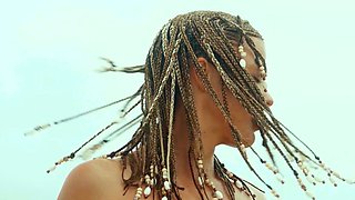 Petite Australian MILF strips at a beach