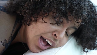 Tiny ebony edges her tight pussy on the couch