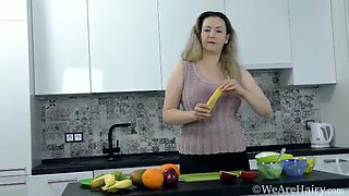 Marsela has fun stripping and enjoying a banana - WeAreHairy