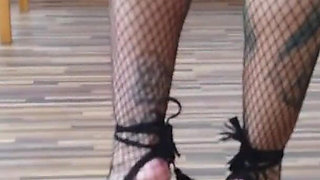 Tattooed lady in fishnet pantyhose
