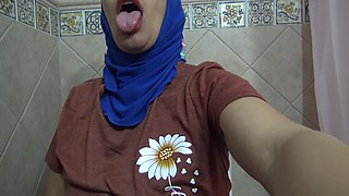 Horny MILF in Hijab Enjoys Fingering Her Asshole in a Public Toilet