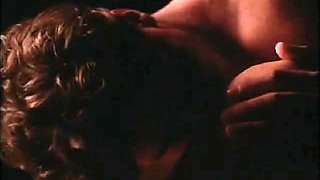 Shannon Tweed bent over a pool table as a guy has sex with