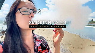 Real Smoking Asian Girl POV: Coming Home to Hot Asian Flashing Her Perky MILF Boobs While Smoking Little Cigars