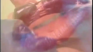 Latex chick enjoys in anal bathroom smash