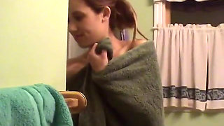 Cute brunette teen soaps up in the shower and takes time to trim her bush