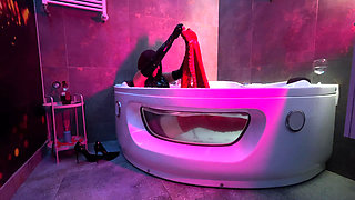 Mistress' Taking a Bath in Latex and Boots